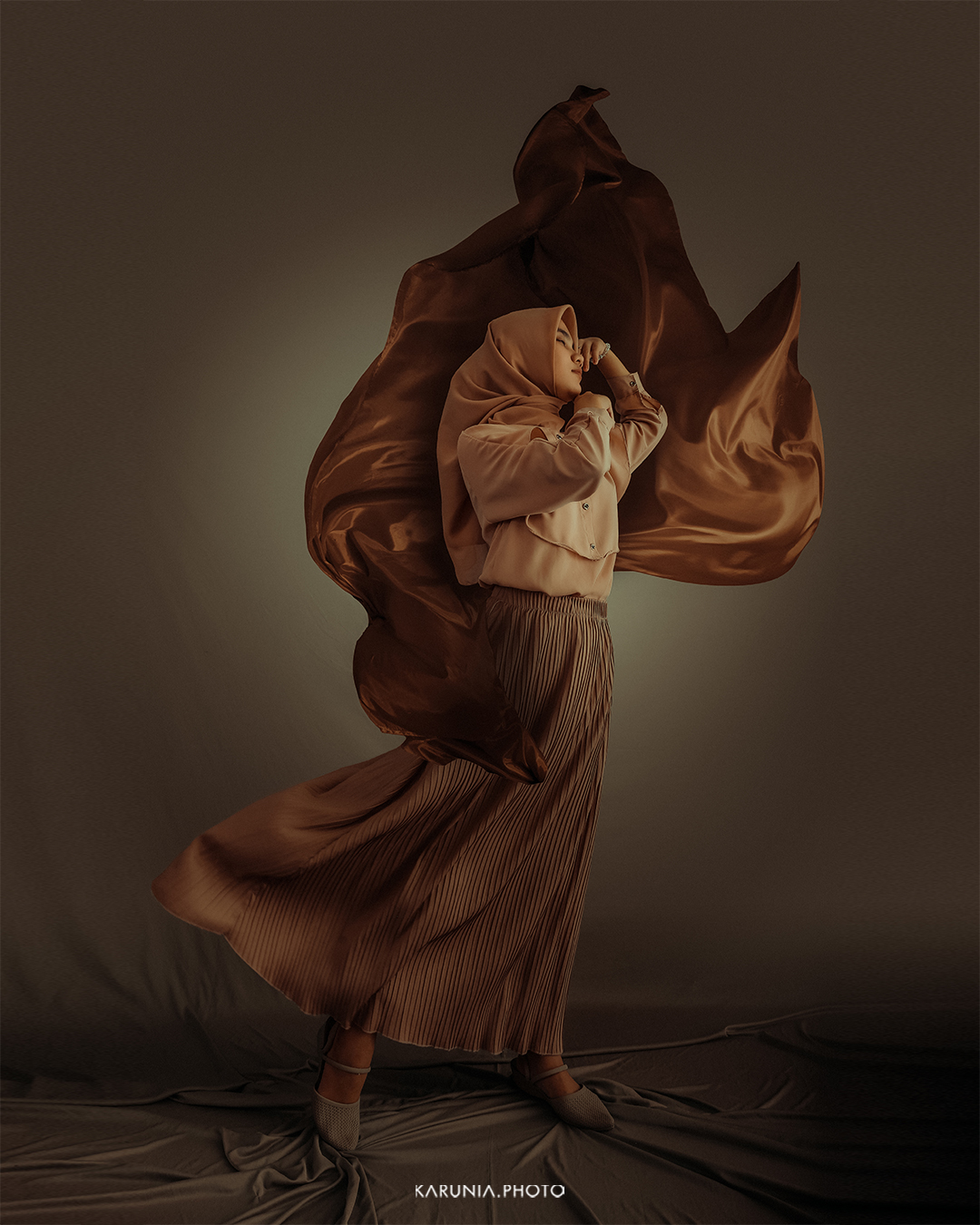 Soft color portrait of a woman with natural makeup and gentle side lighting emphasizing her smile